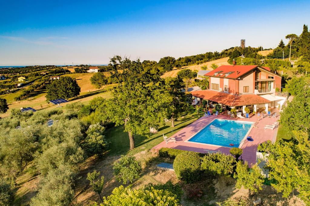 an aerial view of a house with a swimming pool at Villa Dell' Artista - Villa Anna in Santarcangelo di Romagna