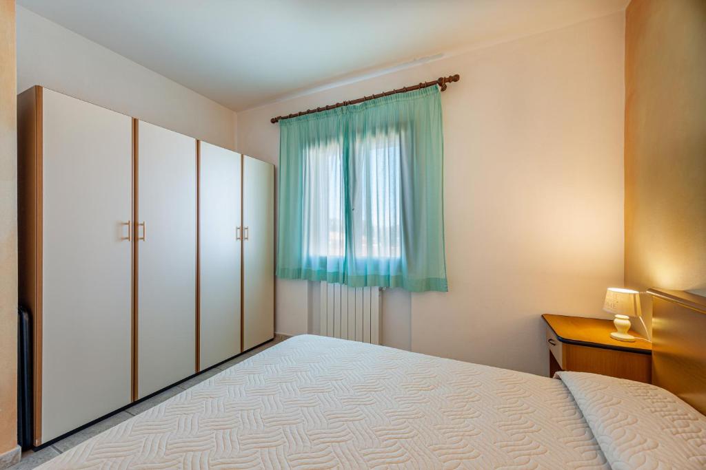 Postel nebo postele na pokoji v ubytování Marina Manna Hotel and Club Village