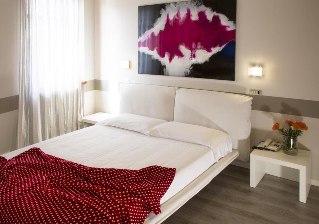 Postel nebo postele na pokoji v ubytování Albergo Al Cacciatore Tortellinando