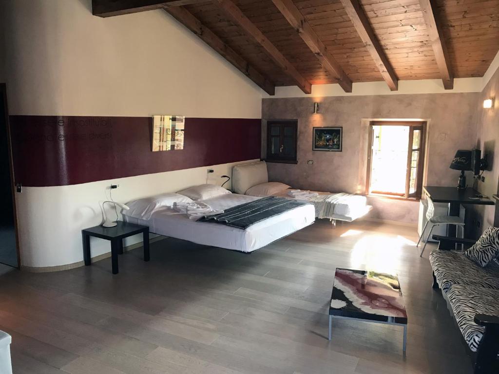 Postel nebo postele na pokoji v ubytování Albergo Al Cacciatore Tortellinando