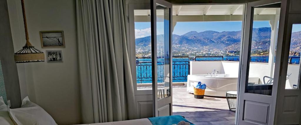 
a hotel room with a view of the ocean at Hotel Port 7- Boutique Collection in Agios Nikolaos
