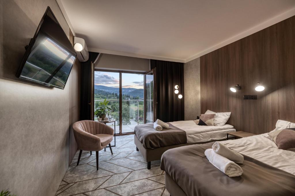 Postel nebo postele na pokoji v ubytování Sudecki Resort & SPA