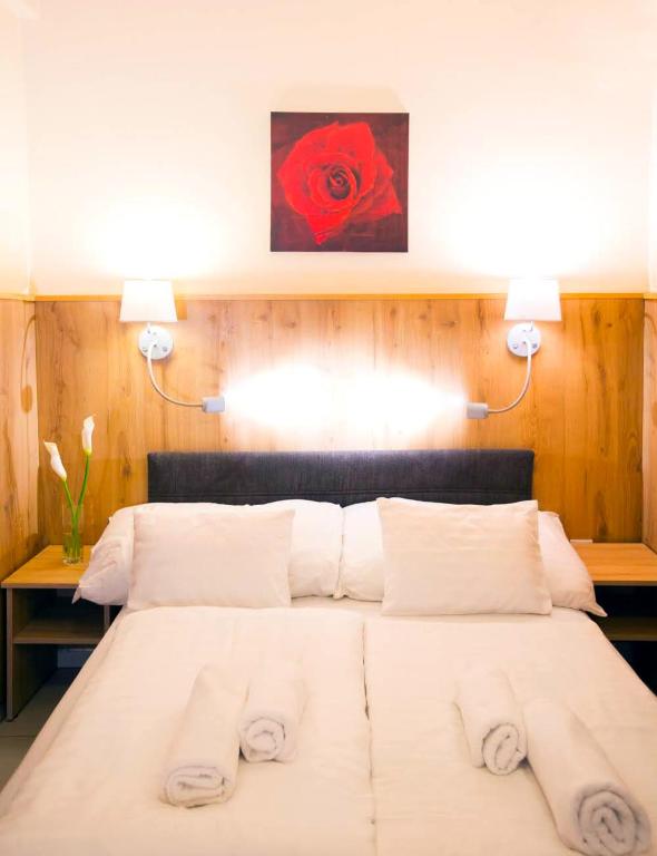 Postel nebo postele na pokoji v ubytování Passzio Panzio