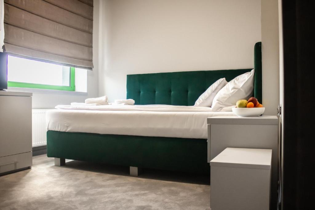 Postel nebo postele na pokoji v ubytování Hotel Promenada Biznes & Wypoczynek