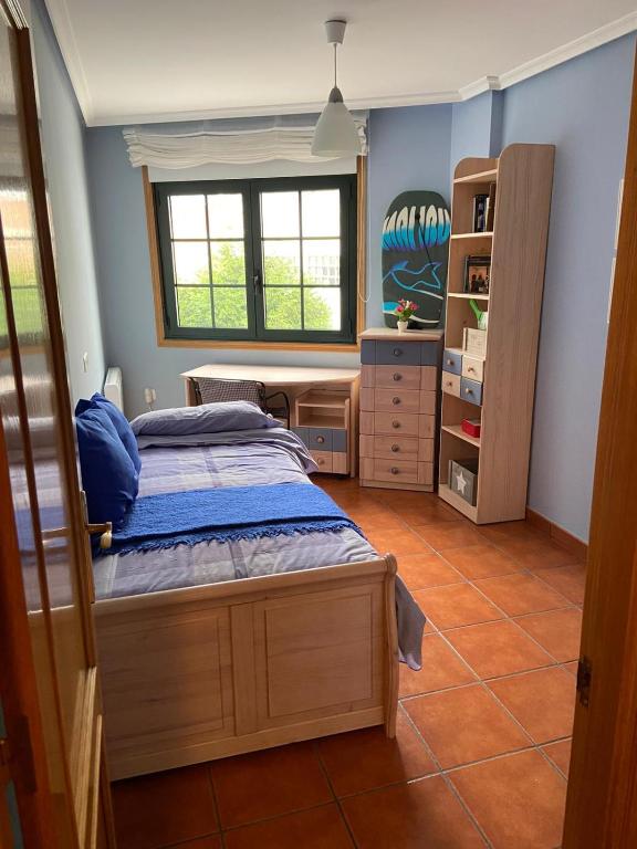 Postel nebo postele na pokoji v ubytování APARTAMENTO PUERTO FOZ