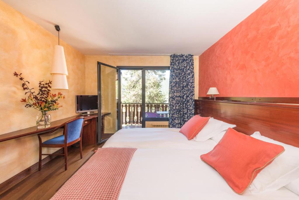 Postel nebo postele na pokoji v ubytování Hotel Coma