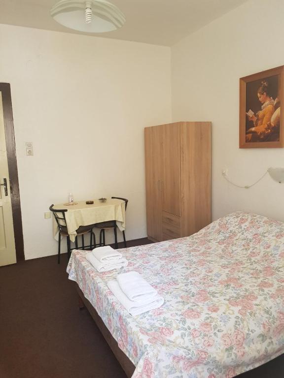 Postel nebo postele na pokoji v ubytování Apartmani Kokić