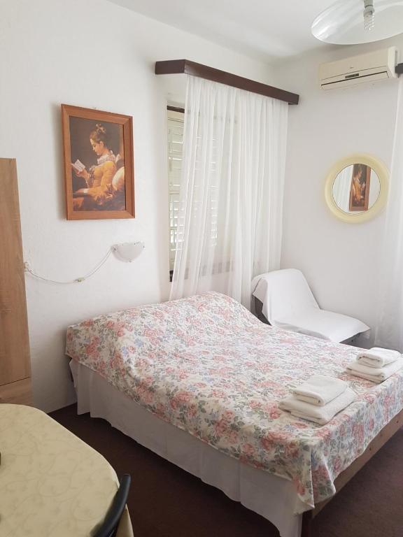 Postel nebo postele na pokoji v ubytování Apartmani Kokić