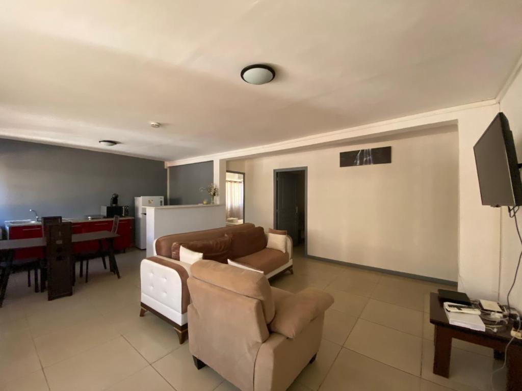 a living room with couches and a pool table at Residence Maeva in Mamoudzou