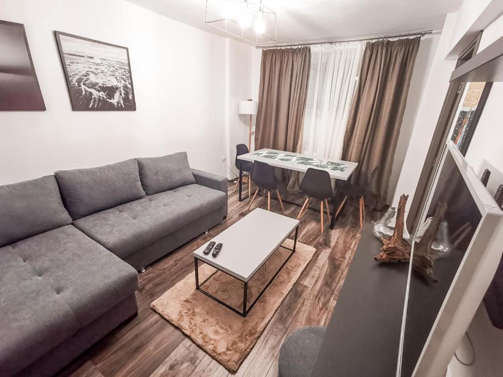 a living room with a couch and a table at Old Town Constanta in Constanţa