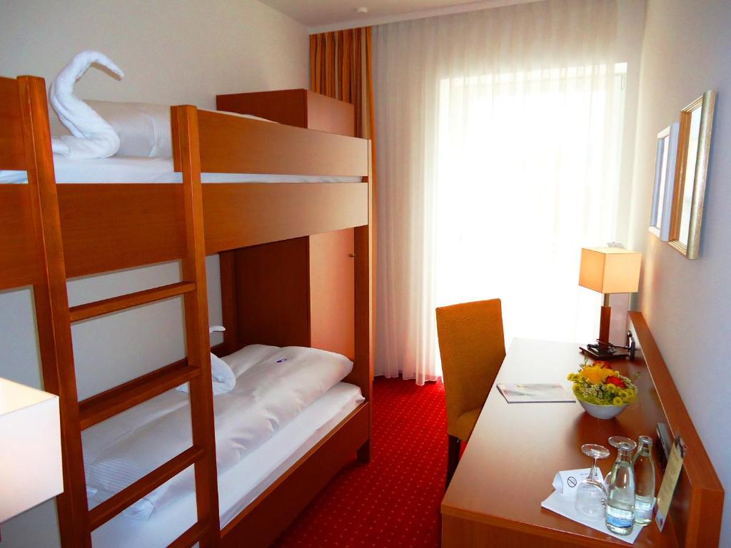 Postel nebo postele na pokoji v ubytování Hotel Gasthof Posthalter