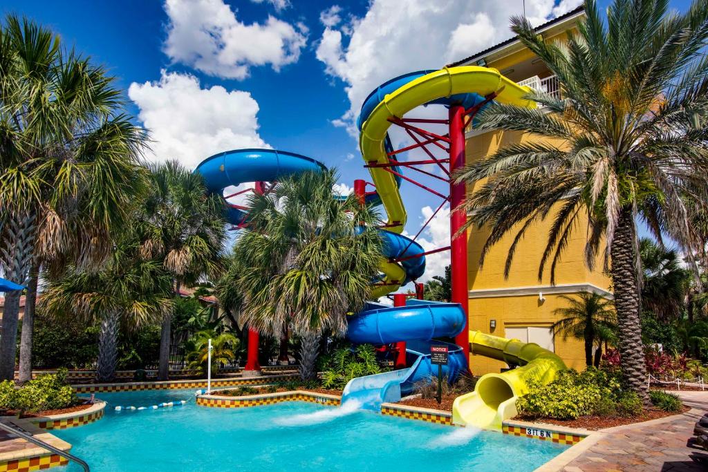 a water park at the resort with a water slide at FantasyWorld Resort in Kissimmee