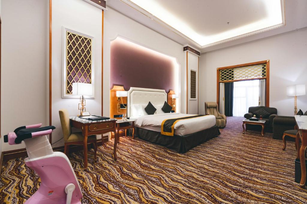 Postel nebo postele na pokoji v ubytování Iridium Hotel