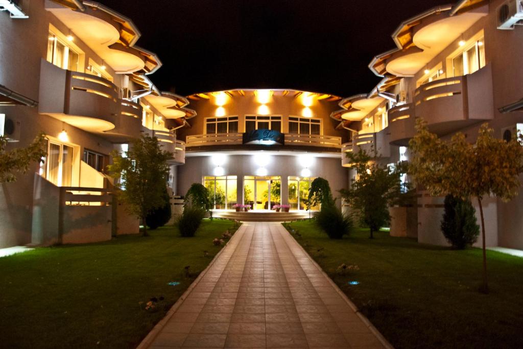 a night view of a building with a walkway at Vila Dincic doo in Veliko Gradište