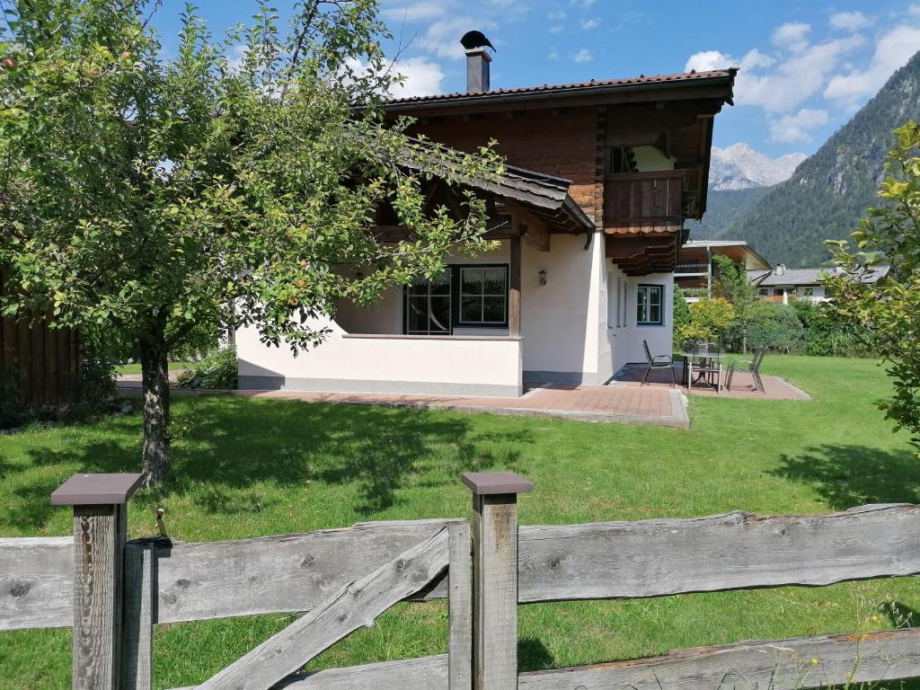 a wooden fence in front of a house at Ferienhaus Flatscher in Lofer
