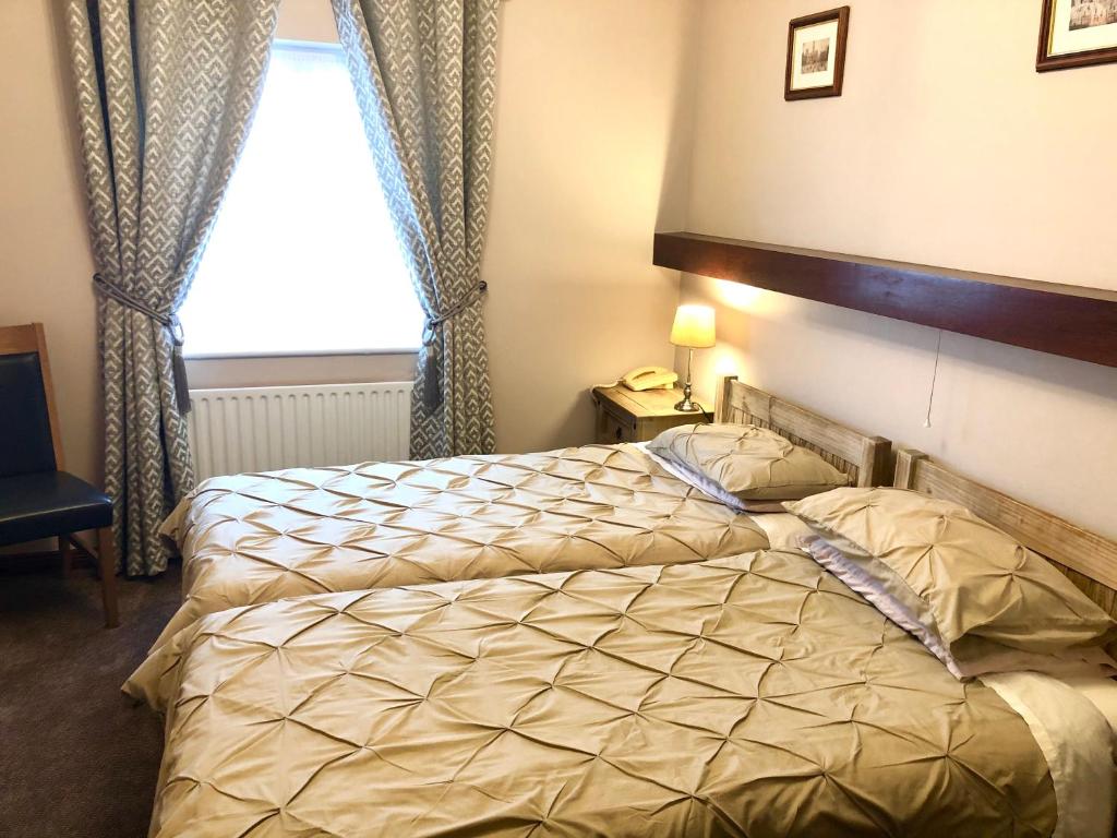 Postel nebo postele na pokoji v ubytování Atlantic Guest House