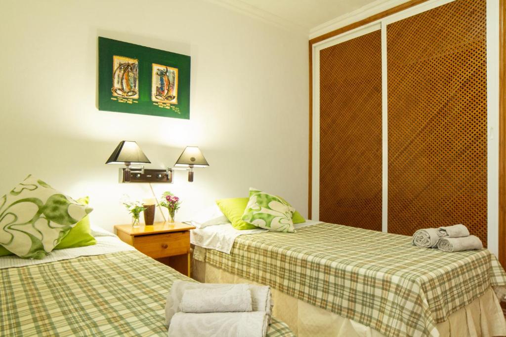 Postel nebo postele na pokoji v ubytování CASA CON PISCINA EN TENERIFE - VISTA MAR Y EL TEIDE