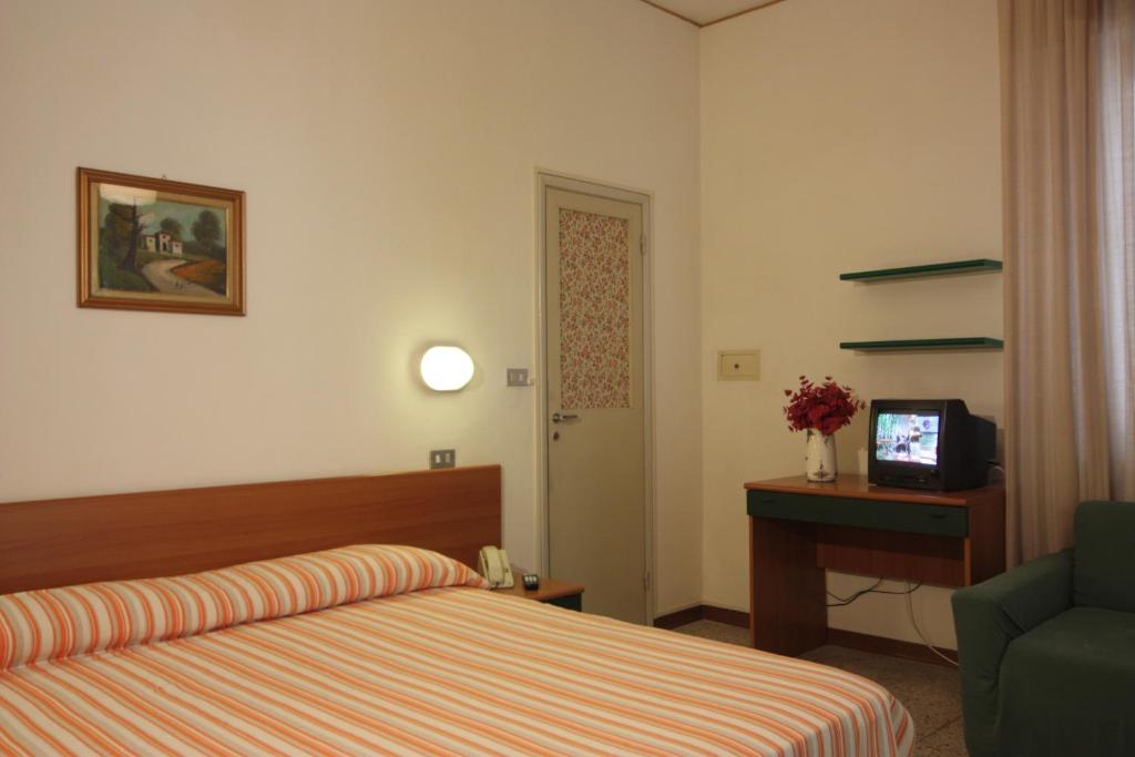 Postel nebo postele na pokoji v ubytování Hotel Garni Picnic
