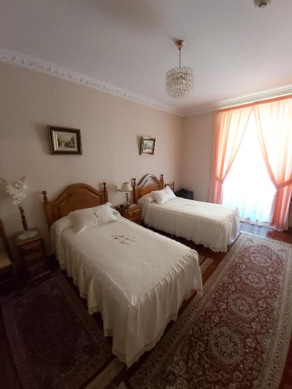 Posteľ alebo postele v izbe v ubytovaní Pension Lorea