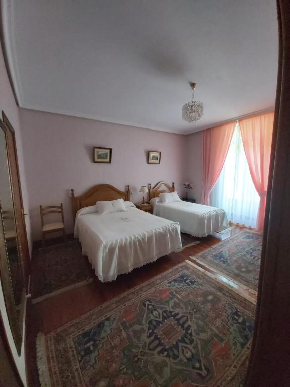 Posteľ alebo postele v izbe v ubytovaní Pension Lorea