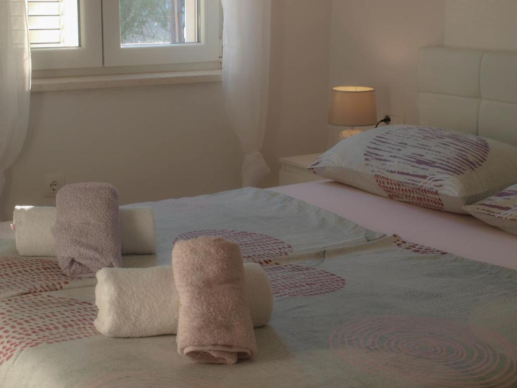 Postel nebo postele na pokoji v ubytování Apartmani Goga 2