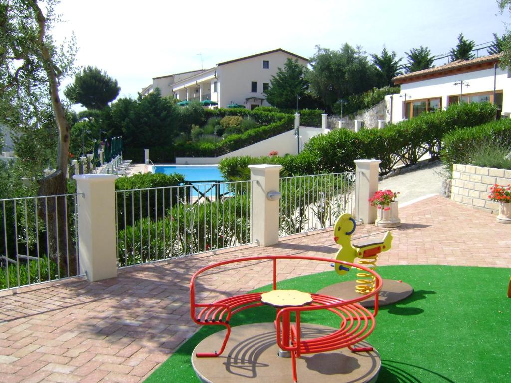 a childs play area with a toy on a playground at Residence Chiesiola in Vieste