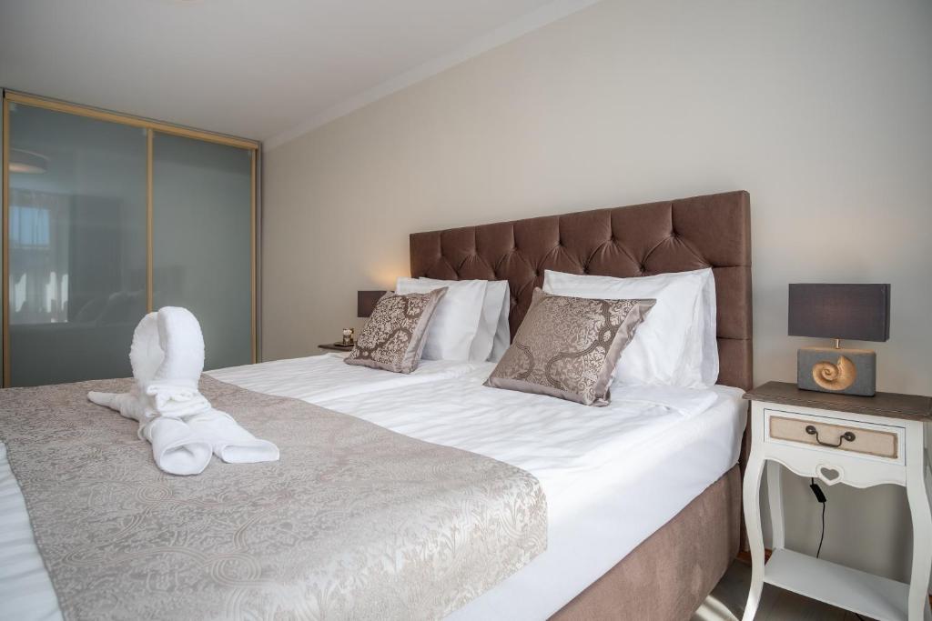 Postel nebo postele na pokoji v ubytování Rataskaevu Boutique - 7 Unique Apartments