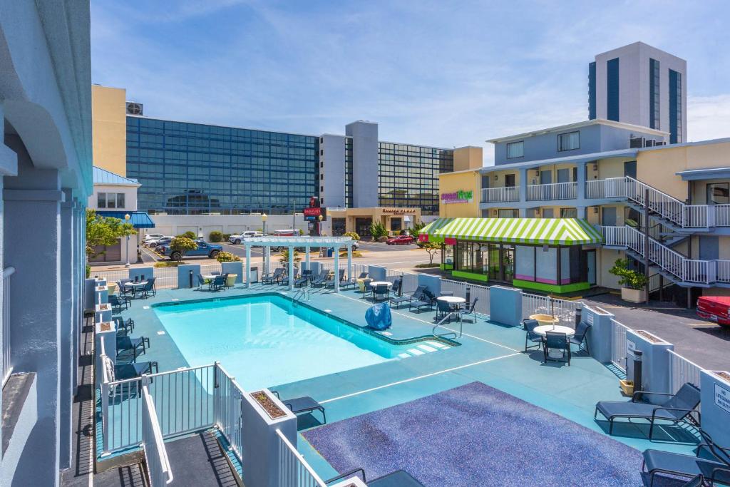 an image of a swimming pool on a building at Ramada by Wyndham Virginia Beach in Virginia Beach