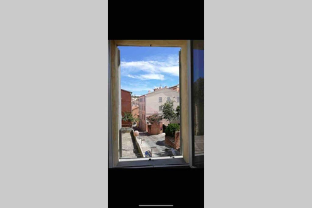 a window with a view of a street at Appartamento nel centro storico in Ancona