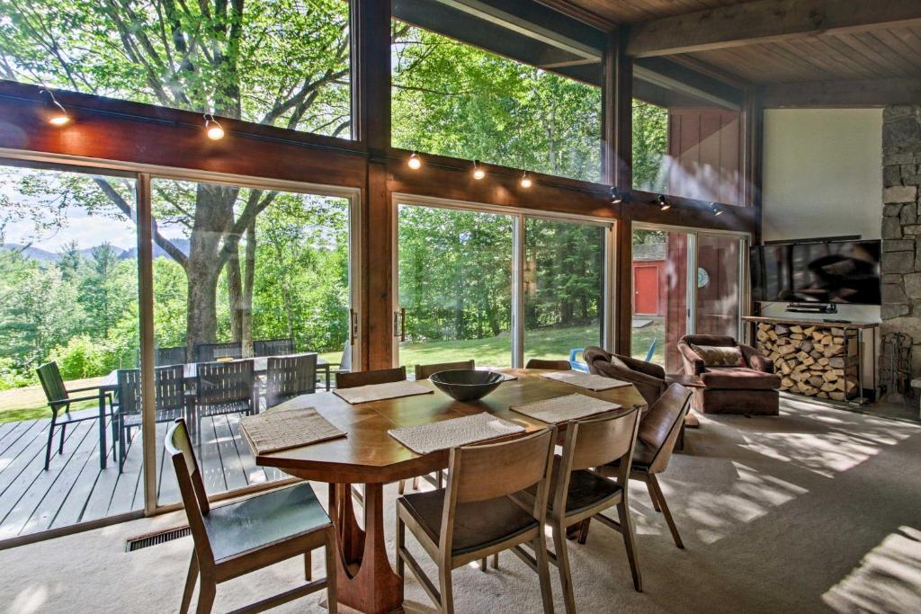 a dining room with a table and chairs at Family-Friendly Glen Home with White Mountain Views! in Glen
