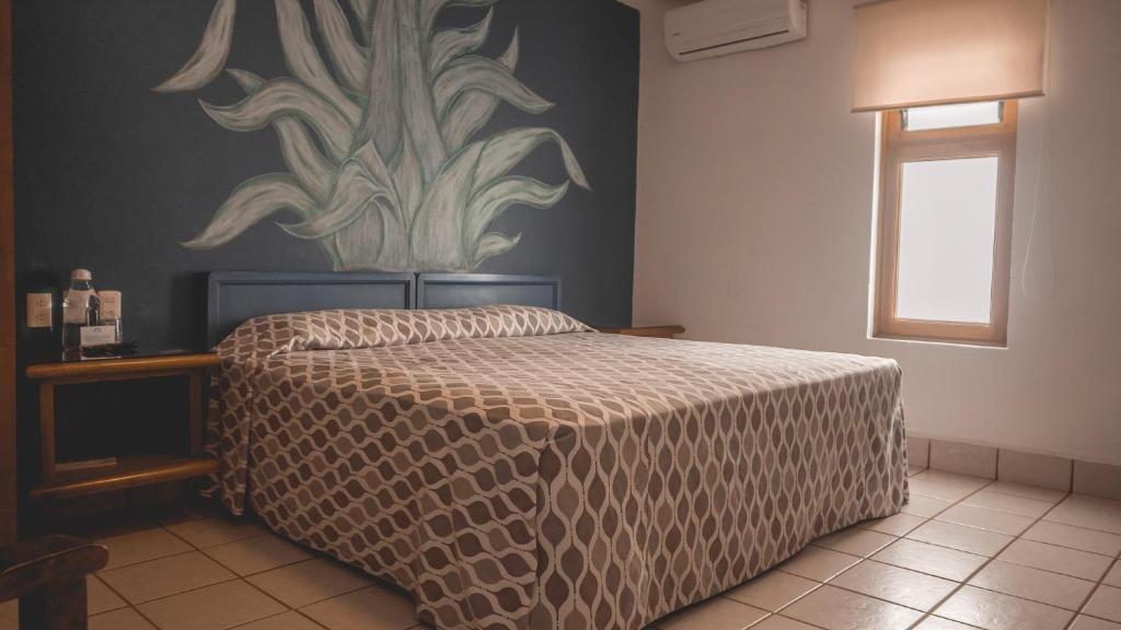 Postel nebo postele na pokoji v ubytování Hotel Aurora