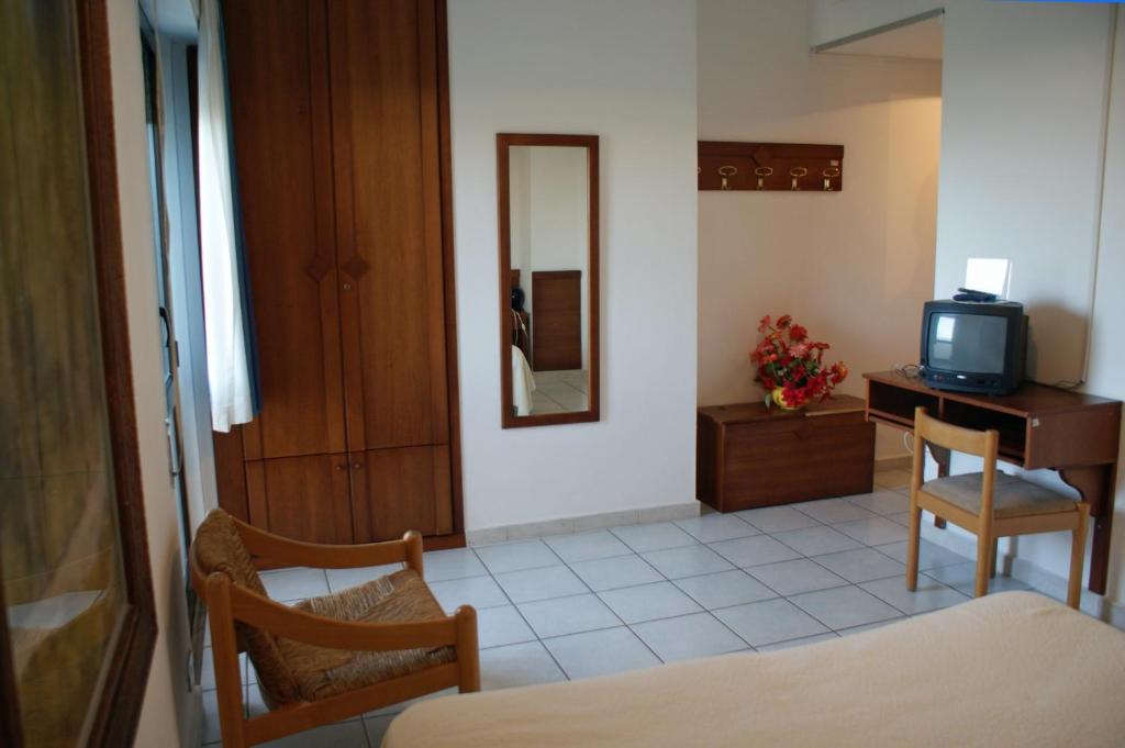 Postel nebo postele na pokoji v ubytování Hotel Nettuno