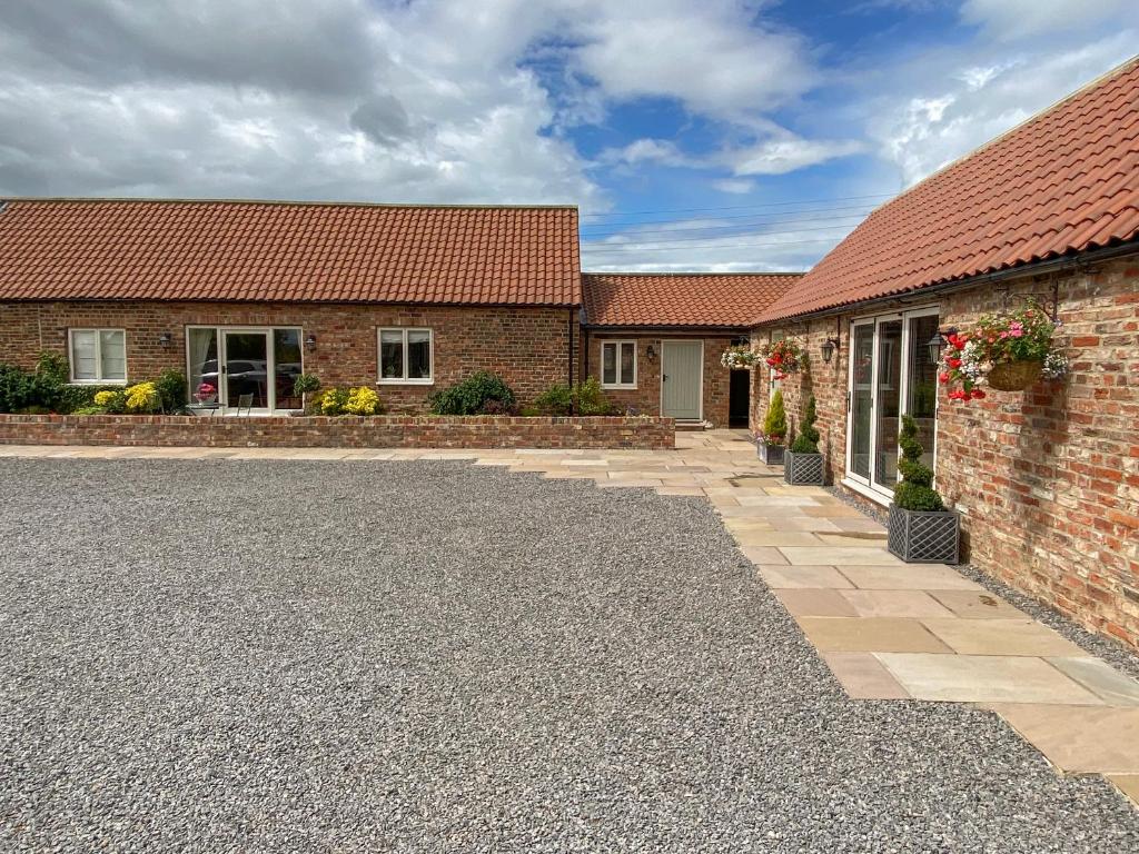 an image of a house with a driveway at The Byre in East Cowton