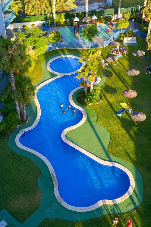 an overhead view of a pool at a resort at Luxury penthouse,first line in Alicante