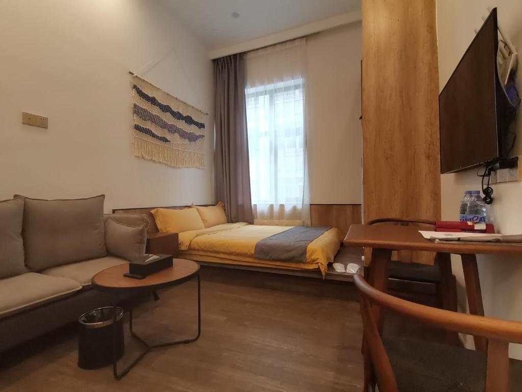 TV a/nebo společenská místnost v ubytování Shenzhen Ruiya Japanese-style Hotel Huaqiang North