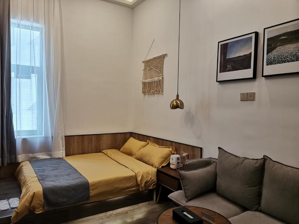 Postel nebo postele na pokoji v ubytování Shenzhen Ruiya Japanese-style Hotel Huaqiang North