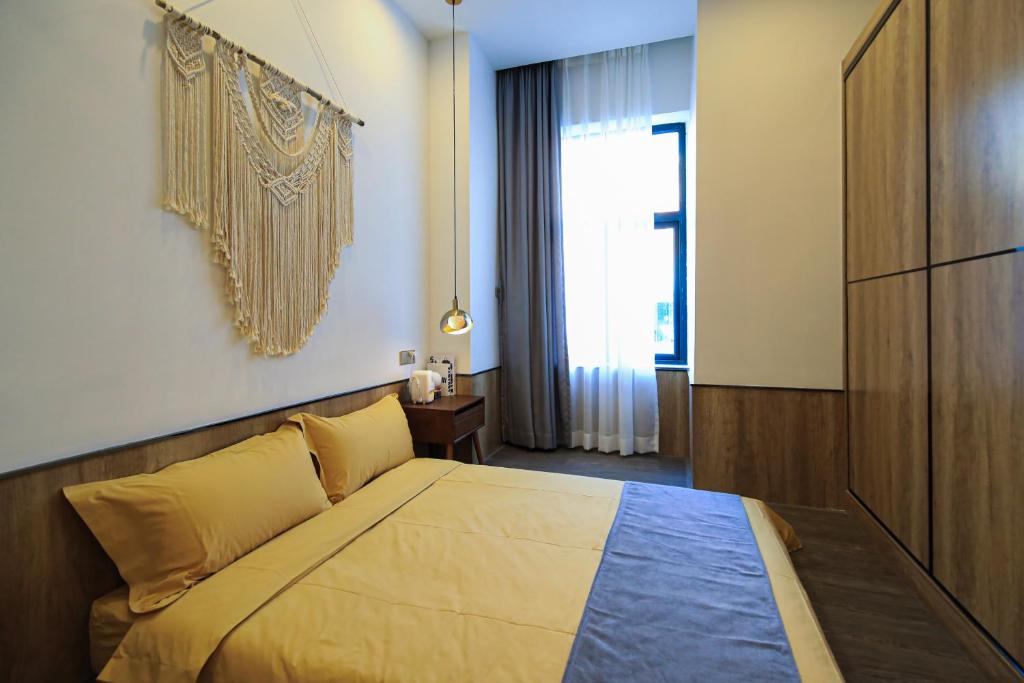 Postel nebo postele na pokoji v ubytování Shenzhen Ruiya Japanese-style Hotel Huaqiang North