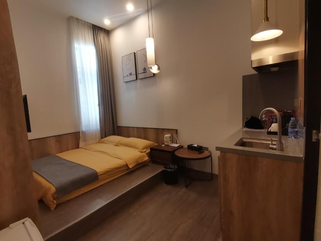 Postel nebo postele na pokoji v ubytování Shenzhen Ruiya Japanese-style Hotel Huaqiang North