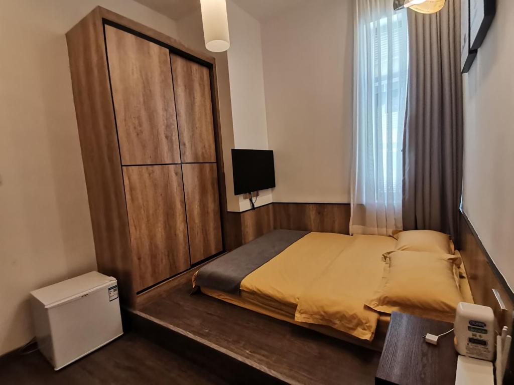 Postel nebo postele na pokoji v ubytování Shenzhen Ruiya Japanese-style Hotel Huaqiang North