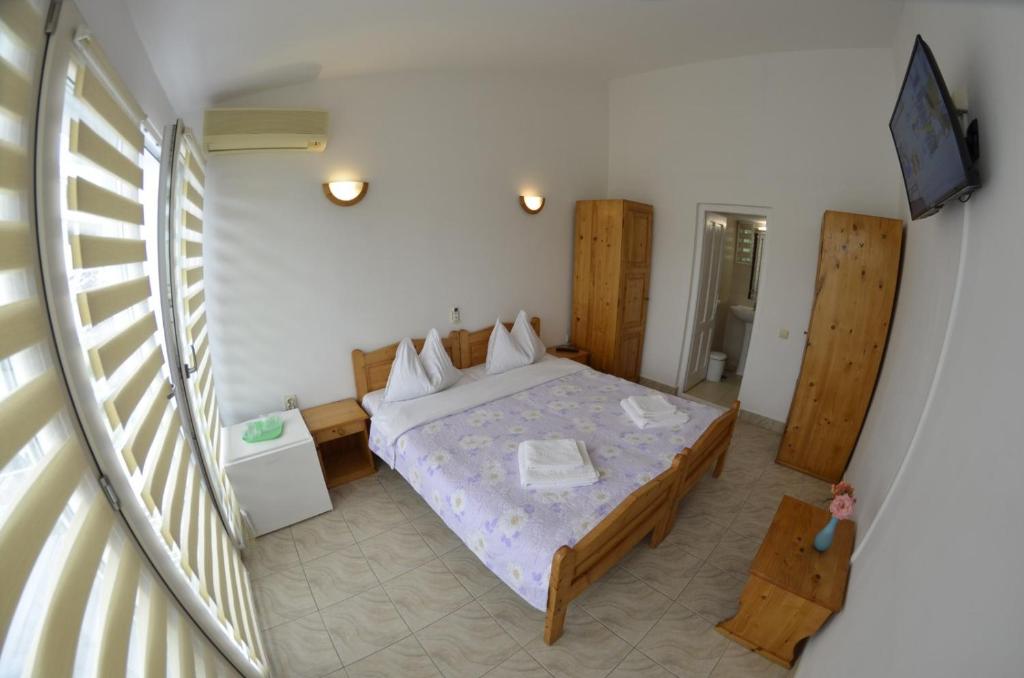 Postel nebo postele na pokoji v ubytování Complex Credo
