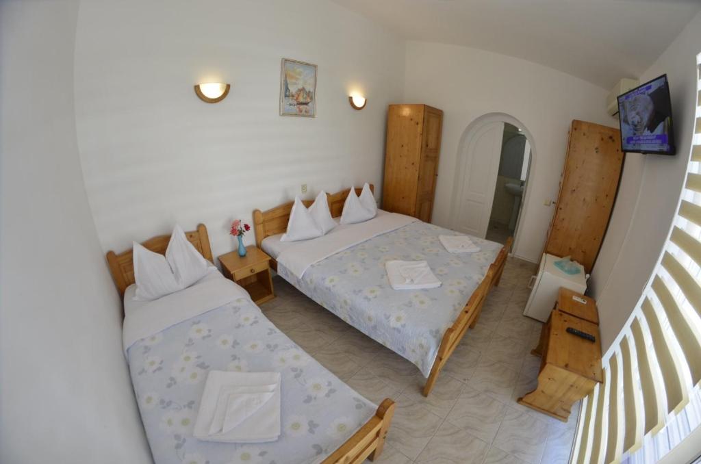 Postel nebo postele na pokoji v ubytování Complex Credo