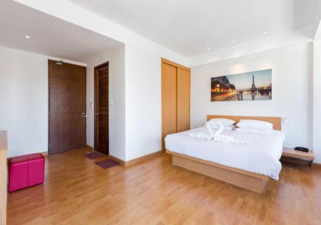 Postel nebo postele na pokoji v ubytování Buk Inn Hotel SHA Plus