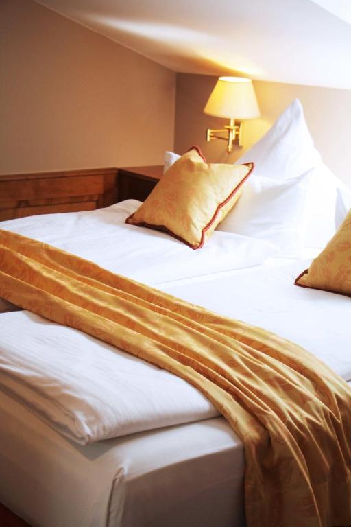 Postel nebo postele na pokoji v ubytování Hotel Kandler