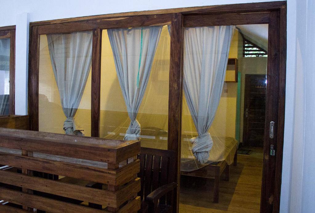 Postel nebo postele na pokoji v ubytování BK Homestay, Batukaras