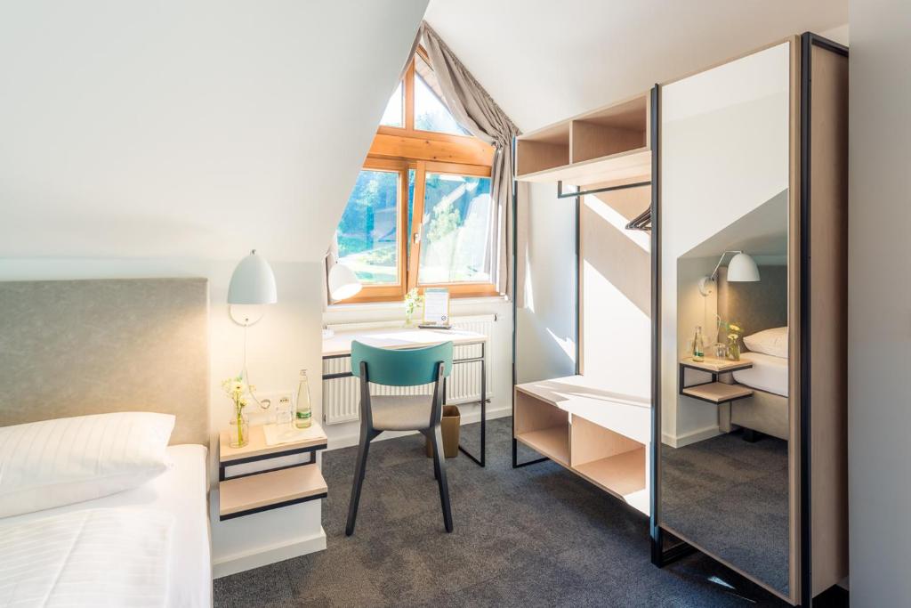Postel nebo postele na pokoji v ubytování Hotel & Restaurant Mühlenglück