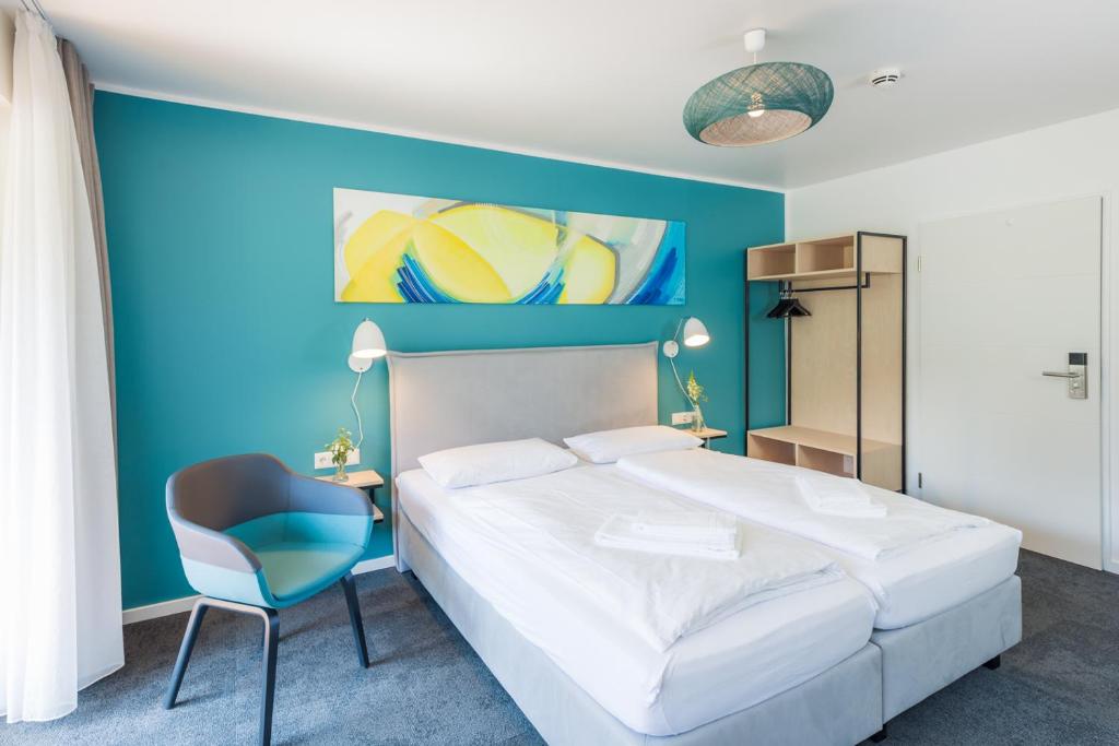 Postel nebo postele na pokoji v ubytování Hotel & Restaurant Mühlenglück