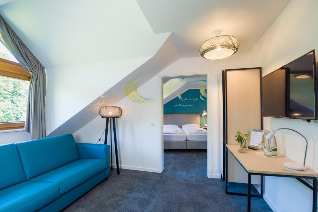 Postel nebo postele na pokoji v ubytování Hotel & Restaurant Mühlenglück