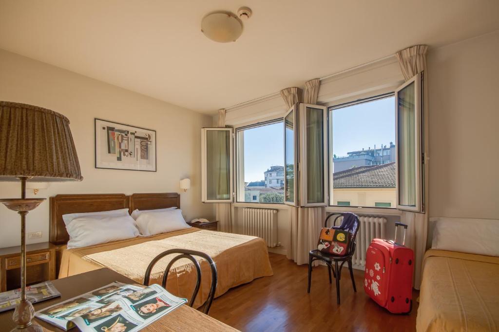 Postel nebo postele na pokoji v ubytování Hotel La Pace