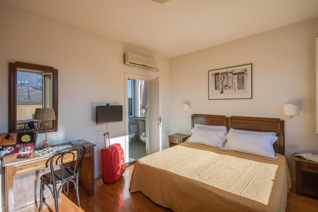 Postel nebo postele na pokoji v ubytování Hotel La Pace
