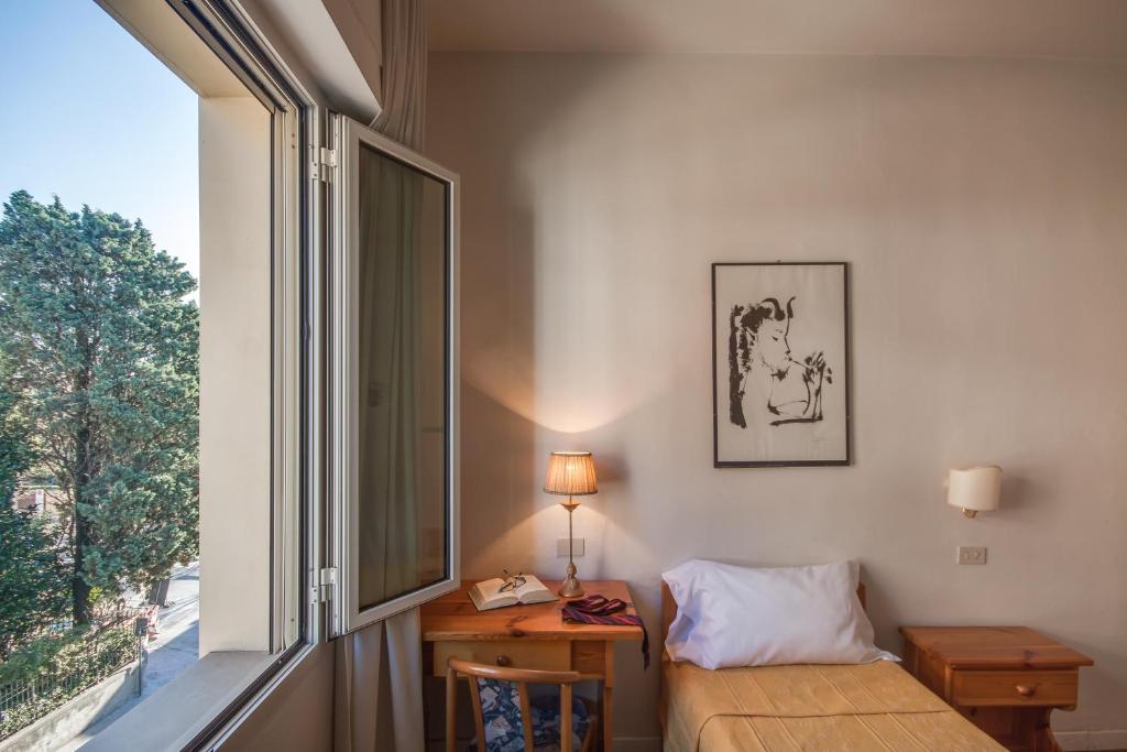 Postel nebo postele na pokoji v ubytování Hotel La Pace